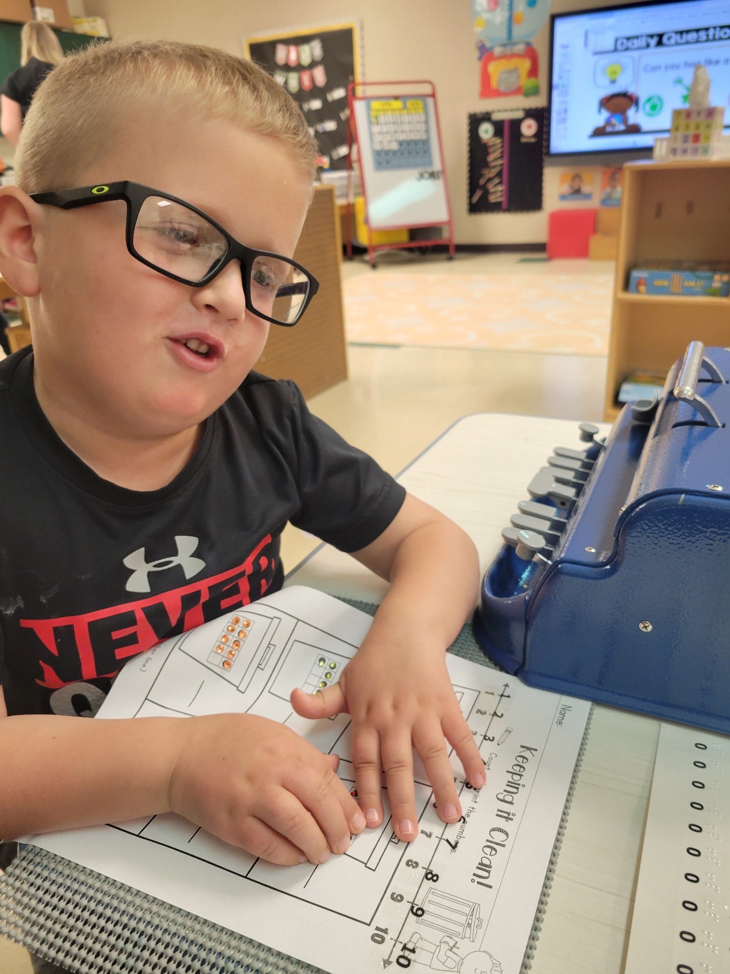 Bo reading Braille