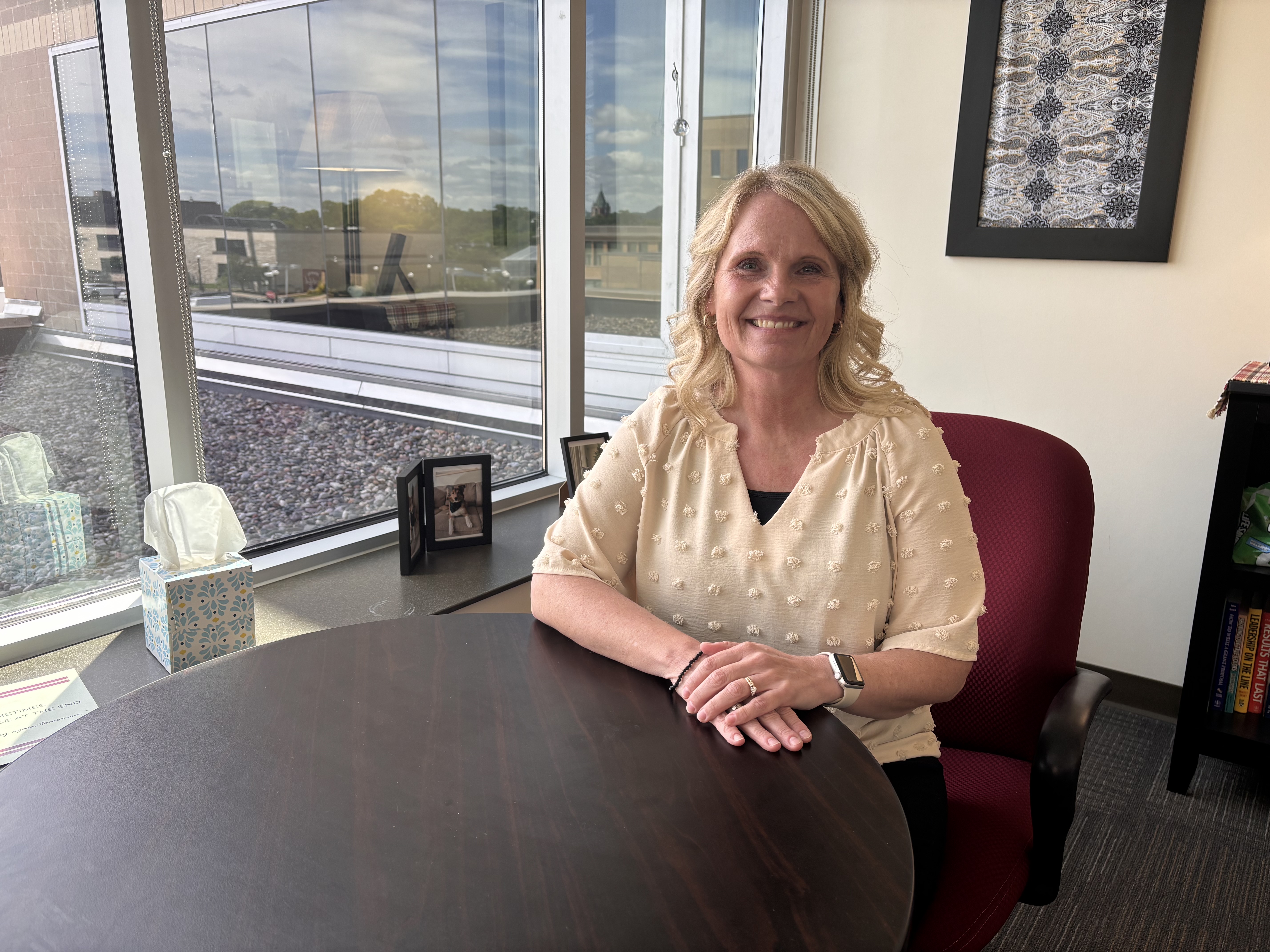 Tracy Puent sitting in her office at La Crosse County Human Services.