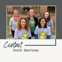 Image of five women in Youth Services t-shirts with the words Contact Youth Services 